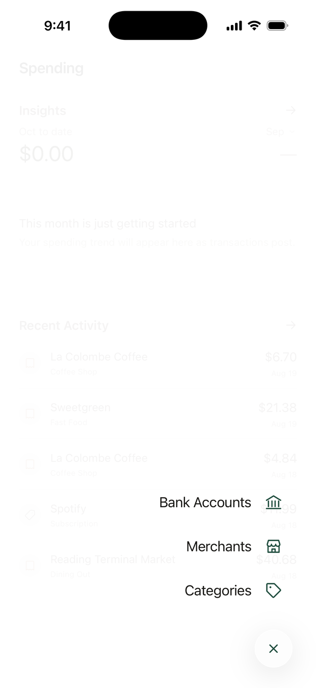 The Spending tab's menu open: Bank Accounts, Merchants, and Categories.
